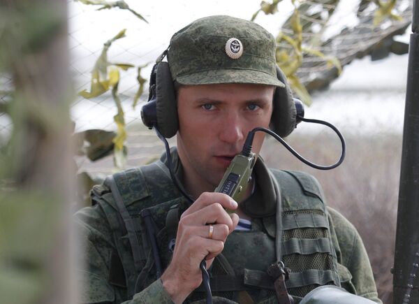 Russian serviceman establishing communication at the command house during the large-scale Center-2011 strategic exercises on the Oimasha range, Kazakhstan Russian serviceman establishing communication at the command house during the large-scale Center-2011 strategic exercises on the Oimasha range, Kazakhstan - Sputnik International