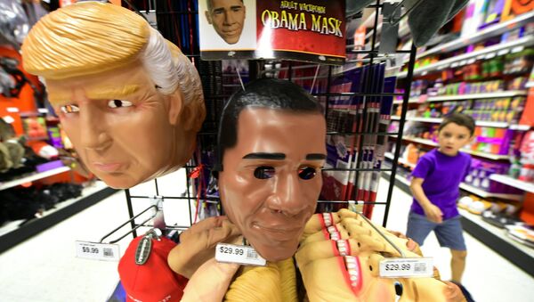 A child walks past a display of masks of US President Barack Obama, and presidential hopefuls Donald Trump and Hillary Clinton, for sale at a shop selling Halloween items in Alhambra, California on October 21, 2016 - Sputnik International