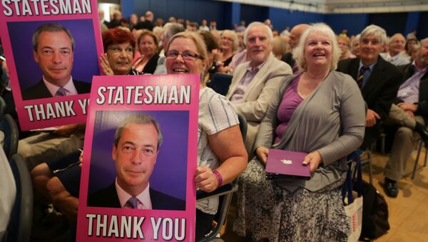 UKIP supporters hold placards of outgoing anti-EU UK Independence Party (UKIP) leader Nigel Farage at the UKIP Autumn Conference in Bournemouth, on the southern coast of England, on September 16, 2016. - Sputnik International