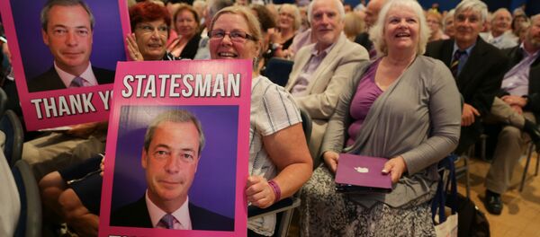 UKIP supporters hold placards of outgoing anti-EU UK Independence Party (UKIP) leader Nigel Farage at the UKIP Autumn Conference in Bournemouth, on the southern coast of England, on September 16, 2016. - Sputnik International