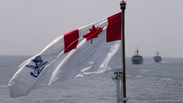 The Royal Canadian Navy Ensign flies on the HMCS Kingston and HMCS Moncton sail behind during the Parade of Ships entering the New York Harbor, Wednesday, May 25, 2016 - Sputnik International