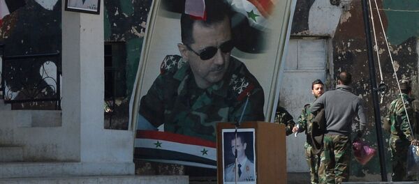 Banners with the portrait of Syrian President Bashar al-Assad at a self-defense fighters' training center near Damascus Banners with the portrait of Syrian President Bashar al-Assad at a self-defense fighters' training center near Damascus - Sputnik International