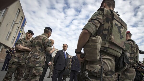 French president Francois Hollande reviews troops at the army base and command centre for France's anti-terror 'Vigipirate' plan, dubbed 'Operation Sentinelle', at the fort of Vincennes, on the outskirts of Paris, France, Monday, July 25, 2016 - Sputnik International