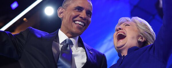 US President Barack Obama (L) hugs US Presidential nominee Hillary Clinton during the third night of the Democratic National Convention at the Wells Fargo Center in Philadelphia, Pennsylvania, July 27, 2016 - Sputnik International
