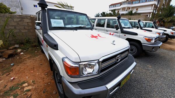 A picture shows vehicles offered to the International Federation of Red Cross and Red Crescent Societies (IFRC) in Senegal by the government of Botswana to help the country fight against Ebola in Dakar on December 2, 2014 - Sputnik International