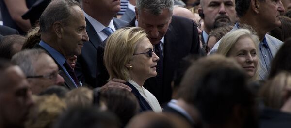 New York City Mayor Bill de Blasio speaks to US Democratic presidential nominee Hillary Clinton during a memorial service at the National 9/11 Memorial September 11, 2016 in New York - Sputnik International