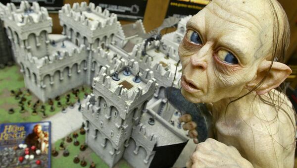 Gollum, a character from the Lord of the Rings tale, sits above a model of the town Minas Tirith during a press presentation for the Spiel '03 (game '03) fair in Essen, Germany, Wednesday Oct. 22, 2003. - Sputnik International