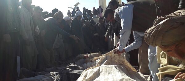 Afghan men gather around the bodies of civilians, including children who were killed by Islamic State militants in Ghor province on October 26, 2016 Afghan men gather around the bodies of civilians, including children who were killed by Islamic State militants in Ghor province on October 26, 2016 - Sputnik International