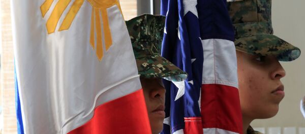 Members of the Philippine-US marine corps stand at attention with the Philippine and American flags during the Philippines-US amphibious landing exercise (PHIBLEX) closing ceremony inside the Philippine Marines headquarters in Taguig city, metro Manila, Philippines October 11, 2016 Members of the Philippine-US marine corps stand at attention with the Philippine and American flags during the Philippines-US amphibious landing exercise (PHIBLEX) closing ceremony inside the Philippine Marines headquarters in Taguig city, metro Manila, Philippines October 11, 2016 - Sputnik International