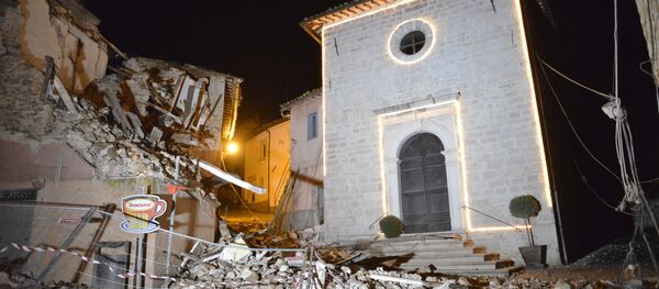 The Church of San Sebastiano stands amidst damaged houses in Castelsantangelo sul Nera, Italy, Wednesday, Oct 26, 2016 following an earthquake,. The Church of San Sebastiano stands amidst damaged houses in Castelsantangelo sul Nera, Italy, Wednesday, Oct 26, 2016 following an earthquake,. - Sputnik International