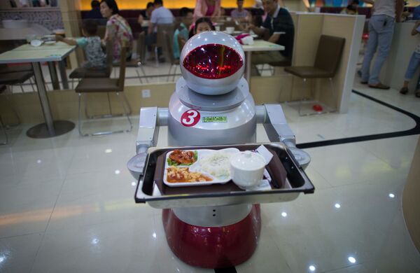 This photo was taken on August 13, 2014, in It's More Teatime Than Terminator, a restaurant in Kunshan, China, where more than a dozen robots to cook and serve food. - Sputnik International