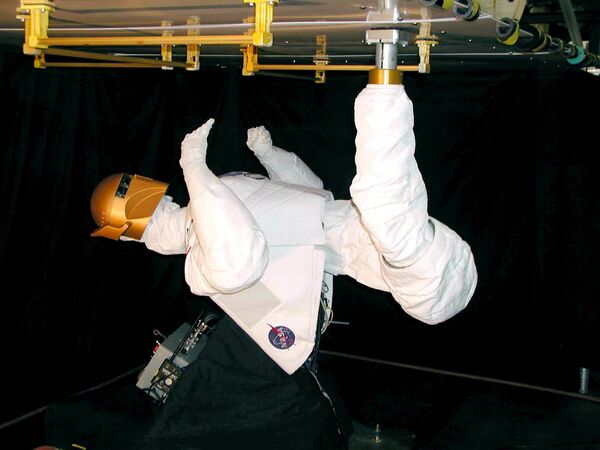 Not only are people trying to take over space; humanoid robots do, too! This NASA file image made on March 2004 shows Robonaut B, a robot built with human-like hands and television camera eyes. The project is a collaborative effort with the Defense Advanced Research Projects Agency (DARPA), and has been under development at Johnson Space Center (JSC) for several years. It is a self-contained robot controlled remotely by a human operator. Robonaut B also has the option of rolling around Earth on a modified two-wheeled scooter or grappling the International Space Station with what researchers call a space leg,” as seen in this image. Robonaut uses a head, torso, arms and dexterous hands to perform tasks using the same tools used by human spacewalkers. - Sputnik International