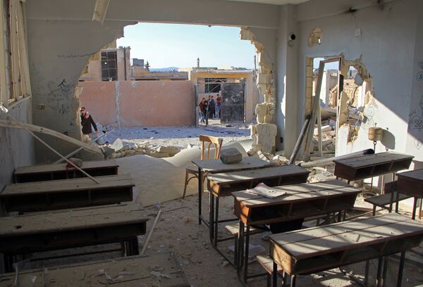 A general view shows a damaged classroom at a school after it was hit in an air strike in the village of Hass, in the south of Syria's rebel-held Idlib province on October 26, 2016. A general view shows a damaged classroom at a school after it was hit in an air strike in the village of Hass, in the south of Syria's rebel-held Idlib province on October 26, 2016. - Sputnik International