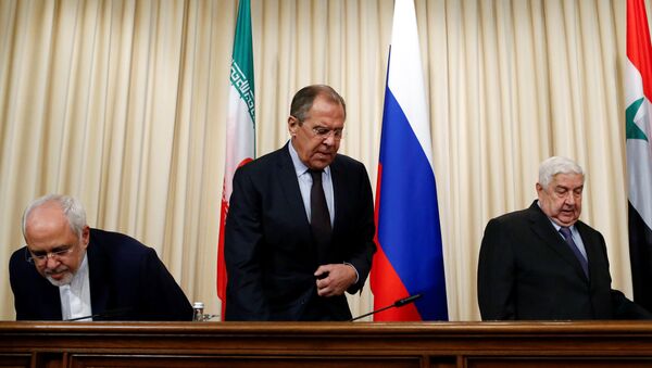 Russian Foreign Minister Sergei Lavrov (C), Syrian Foreign Minister Walid al-Muallem (R) and Iranian Foreign Minister Mohammad Javad Zarif attend a news conference in Moscow, Russia, October 28, 2016. - Sputnik International