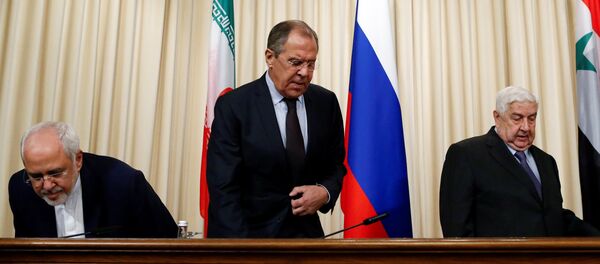 Russian Foreign Minister Sergei Lavrov (C), Syrian Foreign Minister Walid al-Muallem (R) and Iranian Foreign Minister Mohammad Javad Zarif attend a news conference in Moscow, Russia, October 28, 2016. Russian Foreign Minister Sergei Lavrov (C), Syrian Foreign Minister Walid al-Muallem (R) and Iranian Foreign Minister Mohammad Javad Zarif attend a news conference in Moscow, Russia, October 28, 2016. - Sputnik International