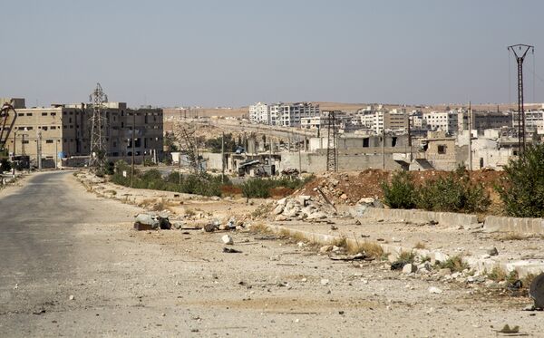 A general view shows a damaged road and abandoned buildings in Aleppo's militant-held Kalasa neighbourhood - Sputnik International