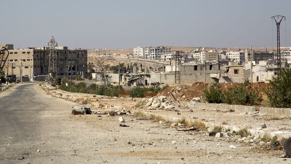 A general view shows a damaged road and abandoned buildings in Aleppo's militant-held Kalasa neighbourhood - Sputnik International