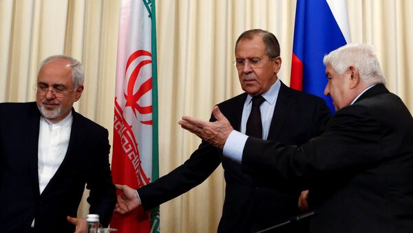 Russian Foreign Minister Sergei Lavrov (C) and his counterparts Walid al-Muallem (R) from Syria and Mohammad Javad Zarif from Iran attend a news conference in Moscow, Russia, October 28, 2016. - Sputnik International