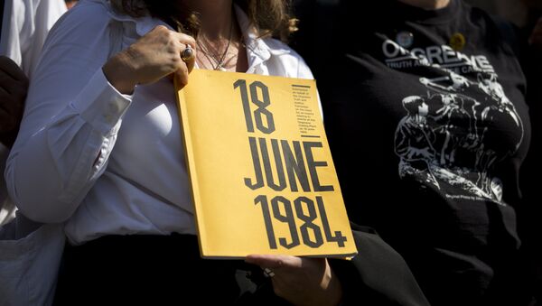 A campaigner holds a book on which the cover reads 18 June 1984 as she stands outside the Houses of Parliament in central London on September 13, 2016, during a protest calling for an inquiry into the ‘Battle of Orgreave’ and the policing of the miners’ strikes - Sputnik International