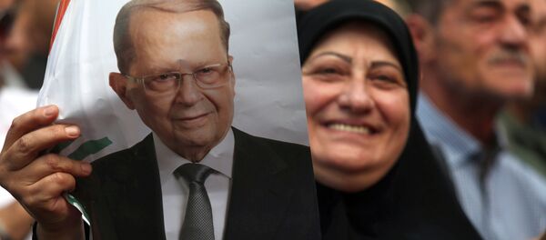 A woman carries a picture of newly elected Lebanese President Michel Aoun in the Haret Hreik area, southern suburbs of Beirut, Lebanon October 31, 2016 A woman carries a picture of newly elected Lebanese President Michel Aoun in the Haret Hreik area, southern suburbs of Beirut, Lebanon October 31, 2016 - Sputnik International