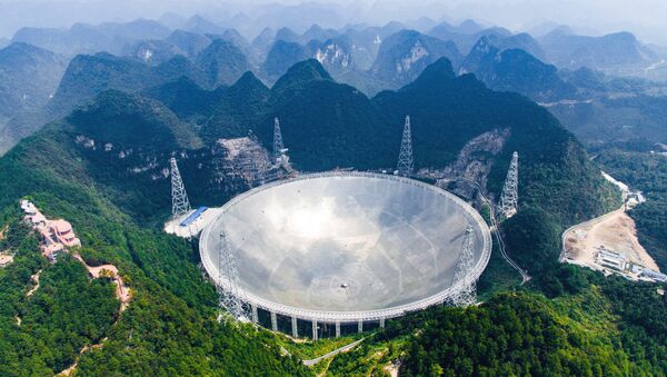 In this Saturday, Sept. 24, 2016 photo released by Xinhua News Agency, an aerial view shows the Five-hundred-meter Aperture Spherical Telescope (FAST) in the remote Pingtang county in southwest China's Guizhou province - Sputnik International