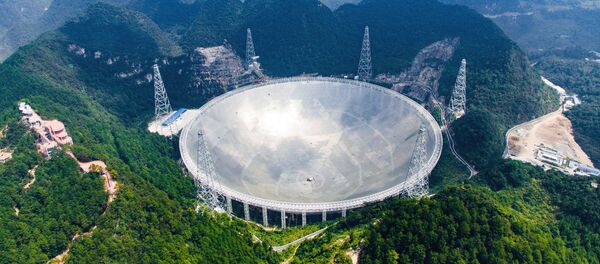 In this Saturday, Sept. 24, 2016 photo released by Xinhua News Agency, an aerial view shows the Five-hundred-meter Aperture Spherical Telescope (FAST) in the remote Pingtang county in southwest China's Guizhou province - Sputnik International