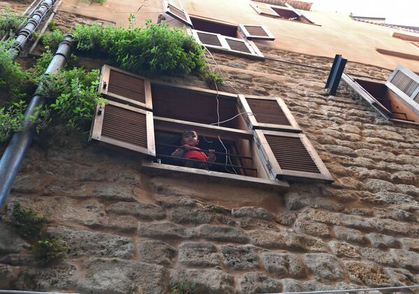 A boy seen from the window of a house in Saida (Sidon), the third largest city in Lebanon. - Sputnik International