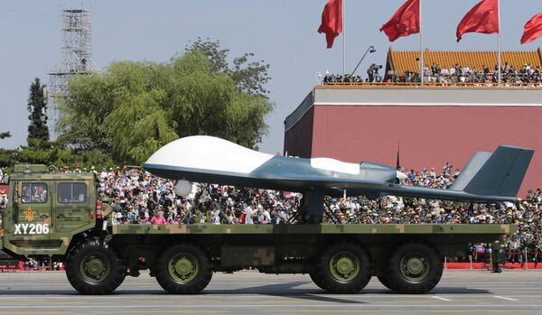 A military vehicle carries a Pterodactyl I unmanned aerial vehicle past the Tiananmen Gate during a military parade to commemorate the 70th anniversary of the end of World War II in Beijing Thursday, Sept. 3, 2015 A military vehicle carries a Pterodactyl I unmanned aerial vehicle past the Tiananmen Gate during a military parade to commemorate the 70th anniversary of the end of World War II in Beijing Thursday, Sept. 3, 2015 - Sputnik International