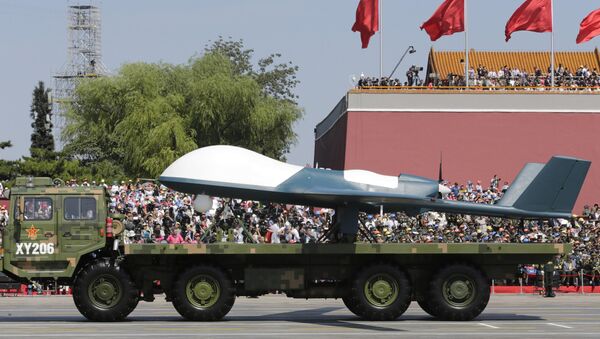 A military vehicle carries a Pterodactyl I unmanned aerial vehicle past the Tiananmen Gate during a military parade to commemorate the 70th anniversary of the end of World War II in Beijing Thursday, Sept. 3, 2015 - Sputnik International
