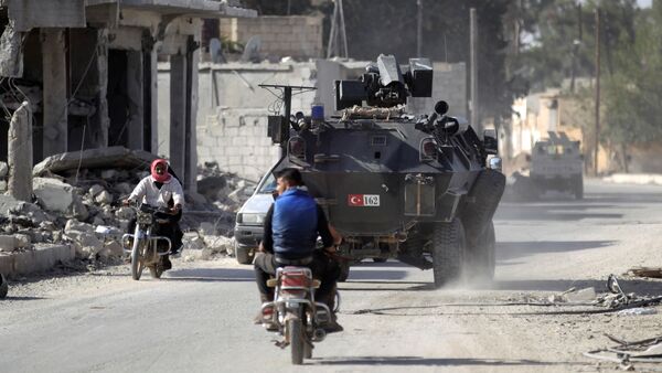 Men ride motorbikes past a Turkish armored carrier in the northern Syrian rebel-held town of al-Rai, in Aleppo Governorate, Syria, October 5, 2016 - Sputnik International