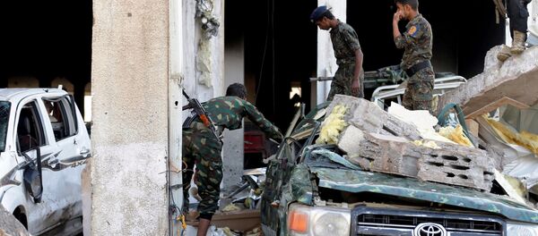 Men inspect the site of an airstrike which witnesses said was by Saudi-led coalition aircraft on mourners at a hall where a wake for the father of Jalal al-Roweishan, the interior minister in the Houthi-dominated Yemeni government, was being held, in Sanaa, Yemen October 8, 2016. Men inspect the site of an airstrike which witnesses said was by Saudi-led coalition aircraft on mourners at a hall where a wake for the father of Jalal al-Roweishan, the interior minister in the Houthi-dominated Yemeni government, was being held, in Sanaa, Yemen October 8, 2016. - Sputnik International
