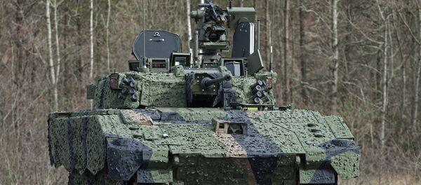 New AJAX prototype shown near its future assembly site in Merthyr Tydfil, Wales New AJAX prototype shown near its future assembly site in Merthyr Tydfil, Wales - Sputnik International