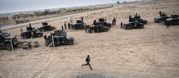 Members of the Iraqi Counter Terrorism Service (CTS) drive near the village of Bazwaya, on the eastern edges of Mosul, tightening the noose on Mosul as the offensive to retake Daesh stronghold entered its third week on October 31, 2016 Members of the Iraqi Counter Terrorism Service (CTS) drive near the village of Bazwaya, on the eastern edges of Mosul, tightening the noose on Mosul as the offensive to retake Daesh stronghold entered its third week on October 31, 2016 - Sputnik International