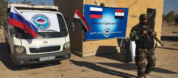 Law enforcement officers in a humanitarian corridor for civilians and militants along the Castello Road in northern Aleppo, Syria Law enforcement officers in a humanitarian corridor for civilians and militants along the Castello Road in northern Aleppo, Syria - Sputnik International