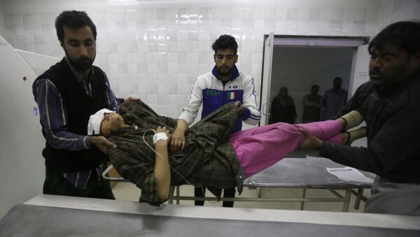 An injured Kashmiri woman is brought for treatment to a hospital in Srinagar, Indian controlled Kashmir, Monday, Oct. 31, 2016 - Sputnik International