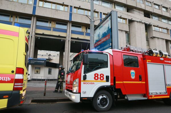 Firefighters near the entrance of the Sputnik HQ - Sputnik International