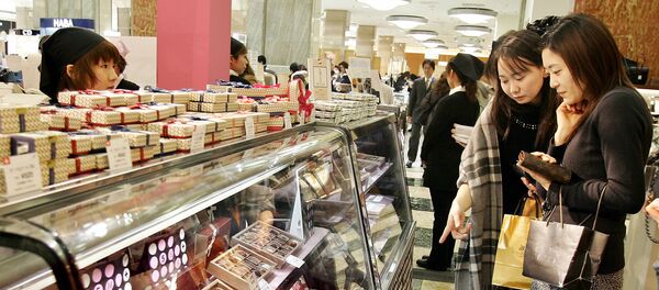 Japanese women look at boxes of chocolates (File) Japanese women look at boxes of chocolates (File) - Sputnik International
