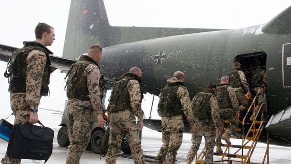 German soldiers enter a Transall C-160 cargo plane at the military airbase Penzing, 50 kilometers (28 miles) west of Munich, southern Germany, on Saturday, Dec. 18, 2004 - Sputnik International