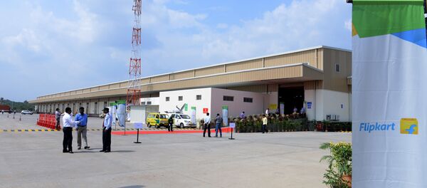 Indian security personel and officials wait at the launch of Flipkart's Largest Fulfillment Centre on the outskirts of Hyderabad (File) - Sputnik International