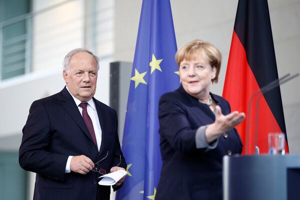 German Chancellor Angela Merkel and Swiss President Johann Schneider-Ammann attend a media conference in the chancellery in Berlin, Germany, November 2, 2016. German Chancellor Angela Merkel and Swiss President Johann Schneider-Ammann attend a media conference in the chancellery in Berlin, Germany, November 2, 2016. - Sputnik International