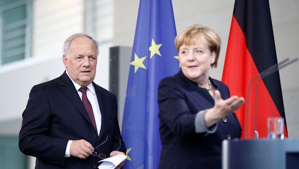 German Chancellor Angela Merkel and Swiss President Johann Schneider-Ammann attend a media conference in the chancellery in Berlin, Germany, November 2, 2016. - Sputnik International