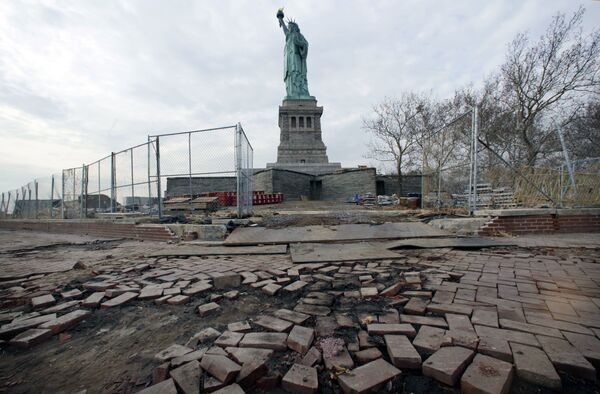 The Statue of Liberty stands beyond parts of a brick walkway damaged in Superstorm Sandy on Liberty Island in New York (File) - Sputnik International