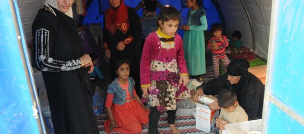 In this photo residents of Mosul and the nearby villages are seen being accomodated in the Hazir refugee camp In this photo residents of Mosul and the nearby villages are seen being accomodated in the Hazir refugee camp - Sputnik International