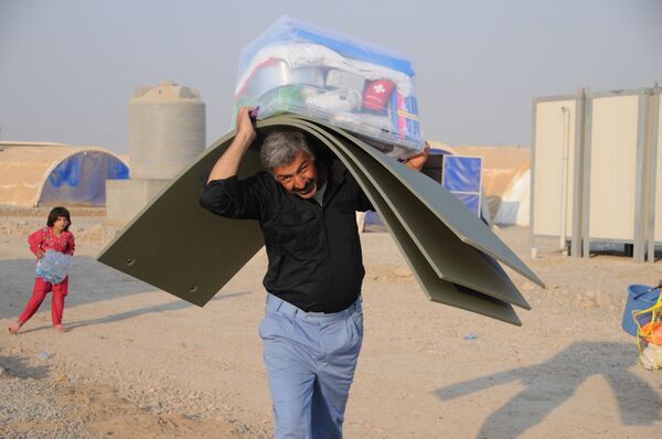 In this photo residents of Mosul and the nearby villages are seen being accomodated in the Hazir refugee camp  - Sputnik International