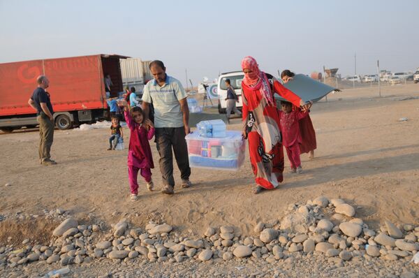 In this photo residents of Mosul and the nearby villages are seen being accomodated in the Hazir refugee camp  - Sputnik International