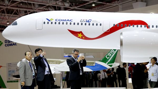 A model of a widebody jet, which is planned to be developed by Commercial Aircraft Corporation of China (COMAC) and Russia's United Aircraft Corporation (UAC) is presented at an air show, the China International Aviation and Aerospace Exhibition, in Zhuhai, Guangdong Province, China, November 2, 2016 - Sputnik International