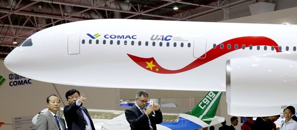 A model of a widebody jet, which is planned to be developed by Commercial Aircraft Corporation of China (COMAC) and Russia's United Aircraft Corporation (UAC) is presented at an air show, the China International Aviation and Aerospace Exhibition, in Zhuhai, Guangdong Province, China, November 2, 2016 A model of a widebody jet, which is planned to be developed by Commercial Aircraft Corporation of China (COMAC) and Russia's United Aircraft Corporation (UAC) is presented at an air show, the China International Aviation and Aerospace Exhibition, in Zhuhai, Guangdong Province, China, November 2, 2016 - Sputnik International