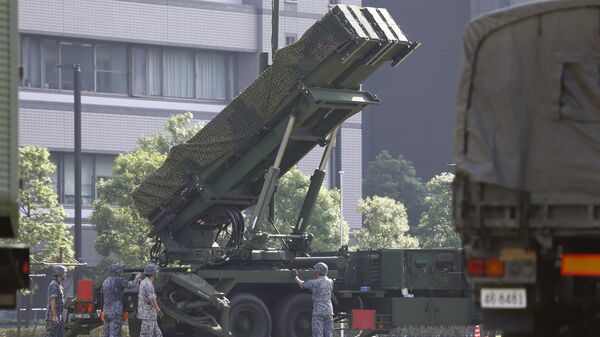 Japan Self-Defense Force members set up a PAC-3 Patriot missile unit deployed ahead of North Korea's planned rocket launch at the Defense Ministry in Tokyo, Tuesday, June 21, 2016 - Sputnik International