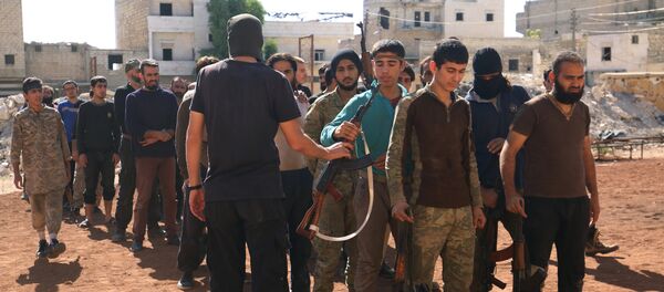 Rebel fighters part of the Jabhat Fatah al Sham, attend military training in the besieged rebel held Aleppo, Syria October 26, 2016 Rebel fighters part of the Jabhat Fatah al Sham, attend military training in the besieged rebel held Aleppo, Syria October 26, 2016 - Sputnik International
