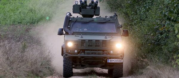 A vehicle of the Austrian army drives to patrol on the border for illegally entering migrants between Hungary and Austria in Nickelsdorf, Austria, Tuesday, Sept. 20, 2016 A vehicle of the Austrian army drives to patrol on the border for illegally entering migrants between Hungary and Austria in Nickelsdorf, Austria, Tuesday, Sept. 20, 2016 - Sputnik International